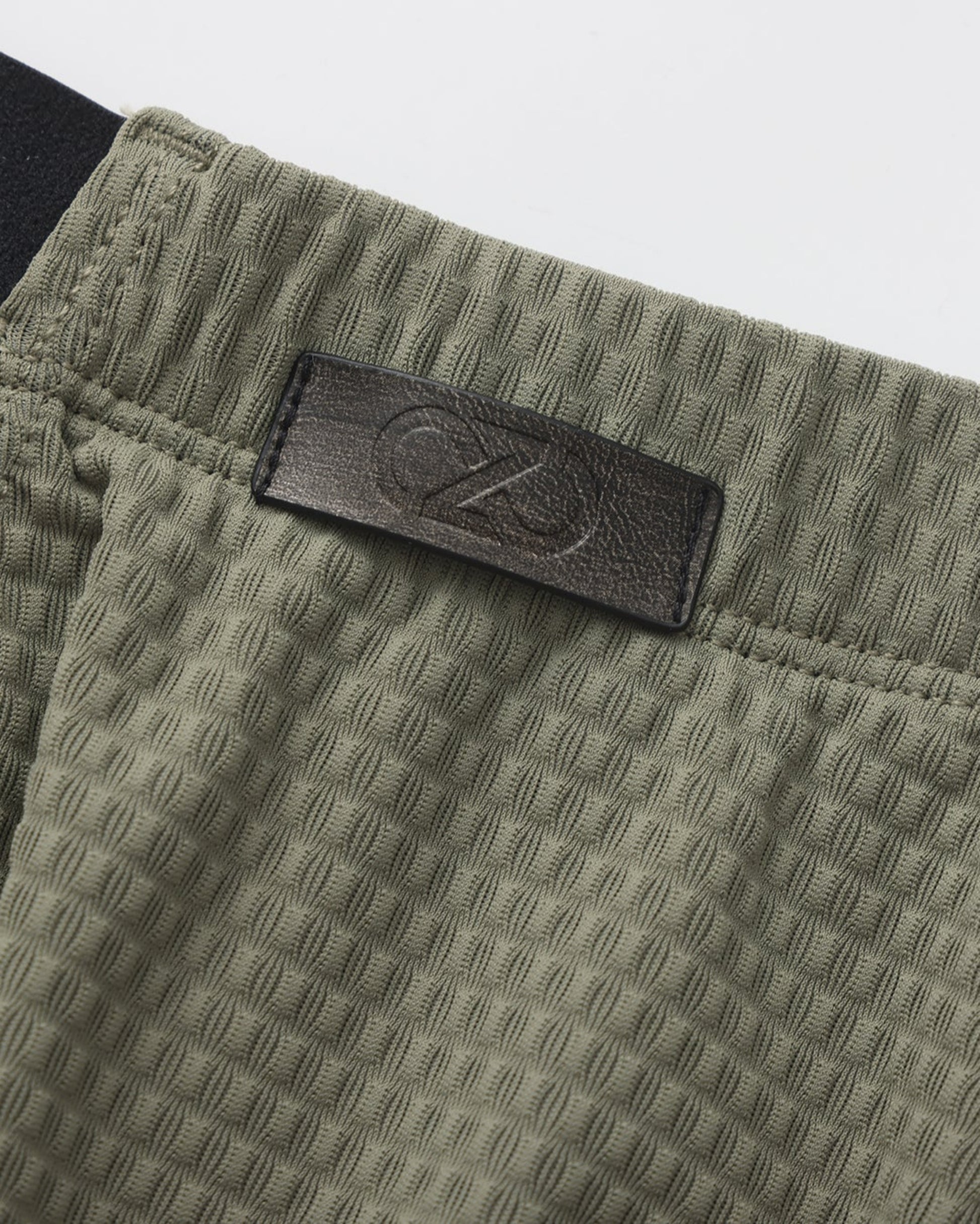 BSZN Net Breaker Cutout Mesh Brief, green dimensional mesh and logo detail