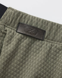 BSZN Net Breaker Cutout Mesh Brief, green dimensional mesh and logo detail