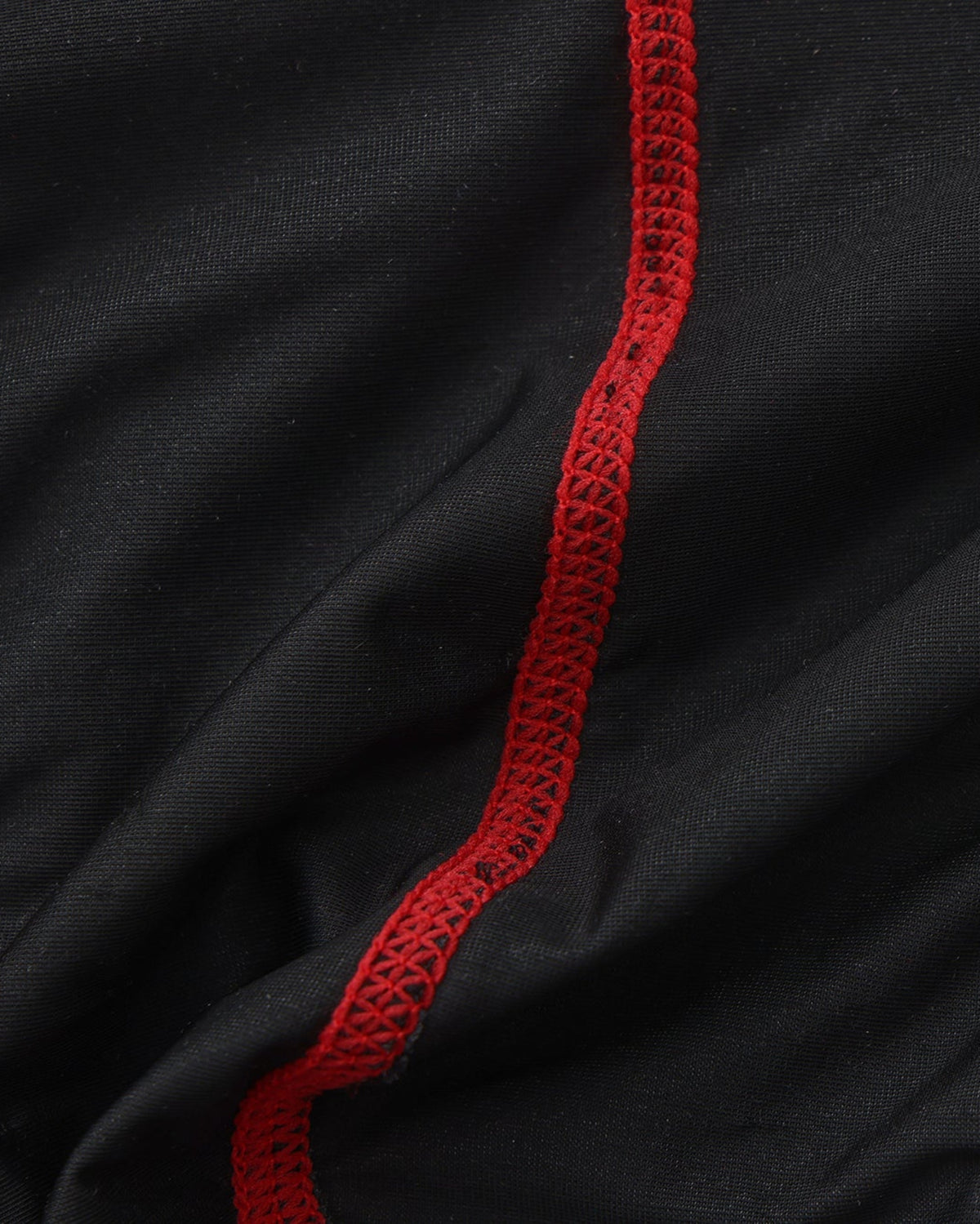 BSZN Spiderweb Heart Cutout Brief — Interior red seam detail.