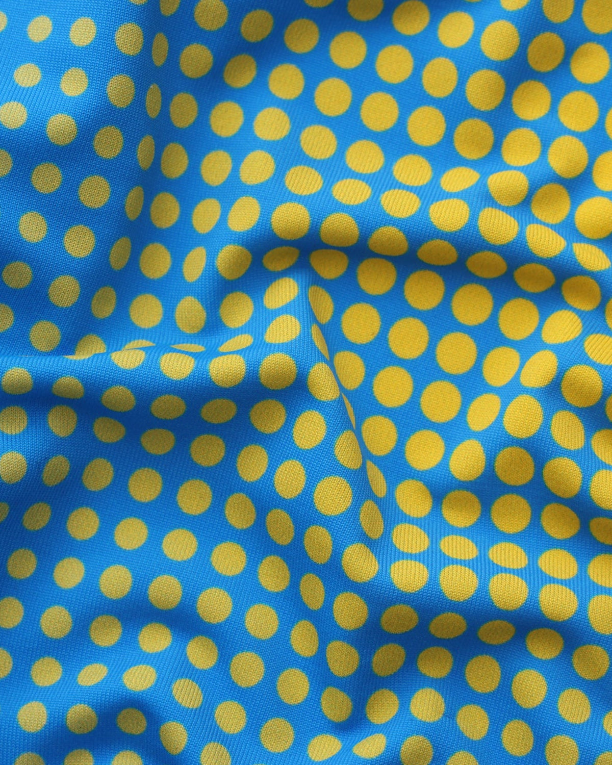 BSZN Gradient Dot Brief — Blue and yellow dot pattern close-up.