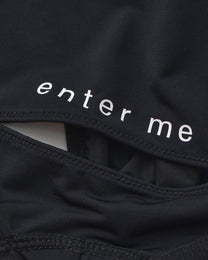 Close-up of the enter me lettering and rear cutout