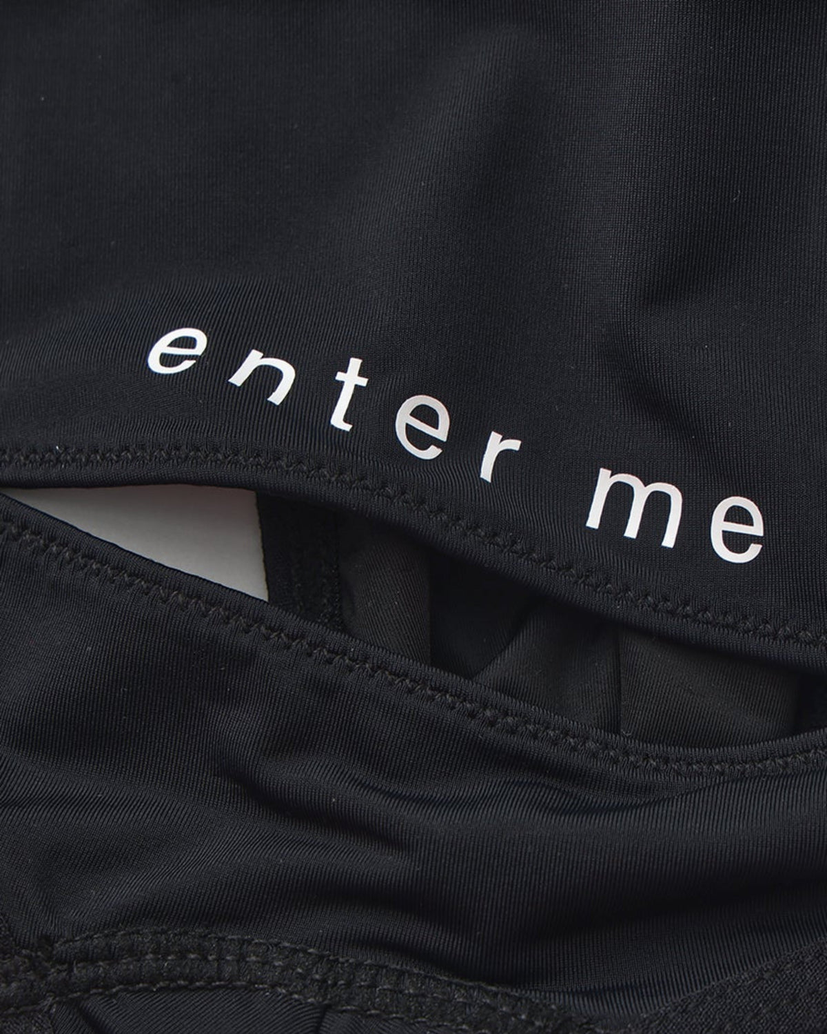 Close-up of the enter me lettering and rear cutout