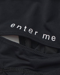 Close-up of the enter me lettering and rear cutout