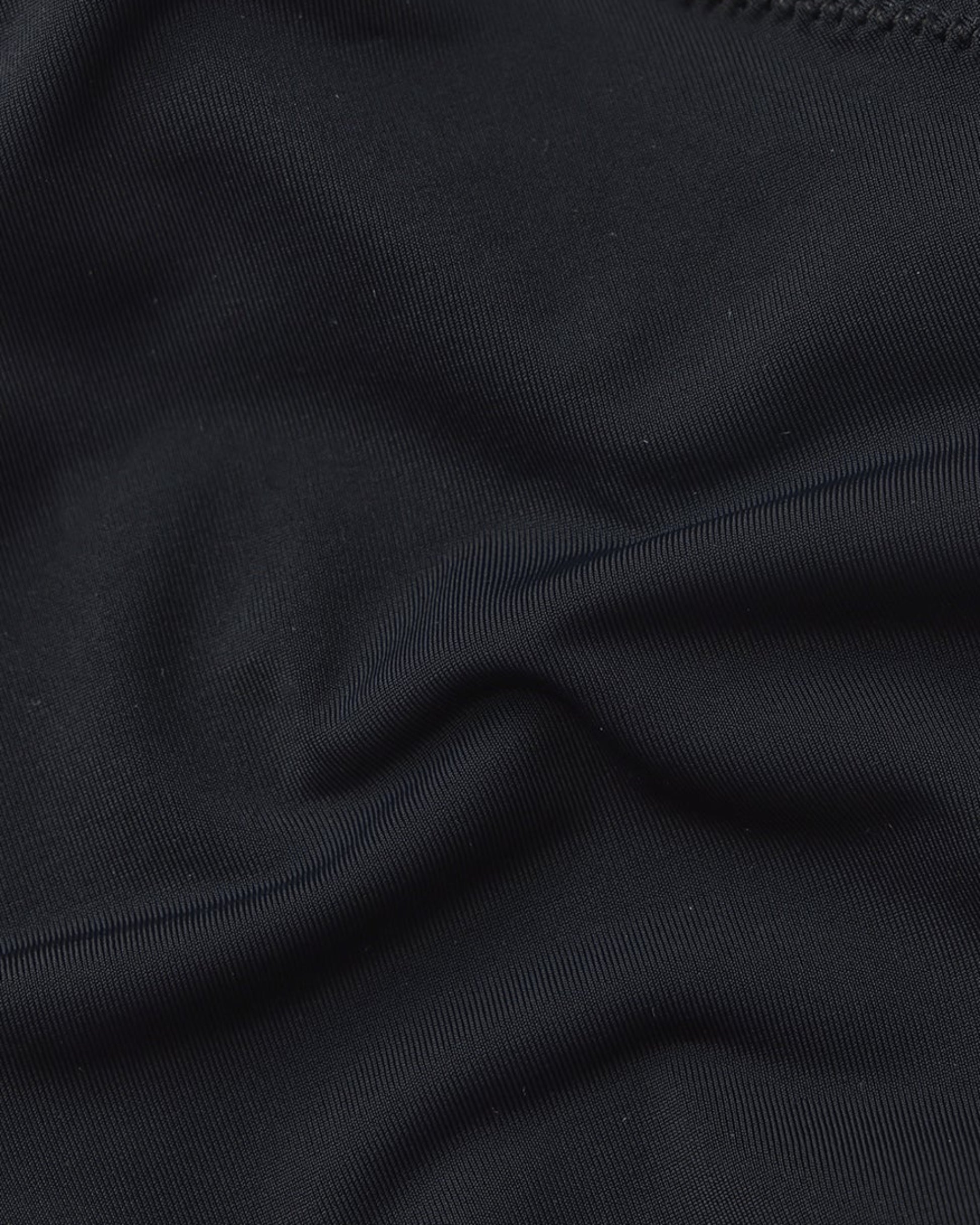 Close-up of smooth black stretch fabric