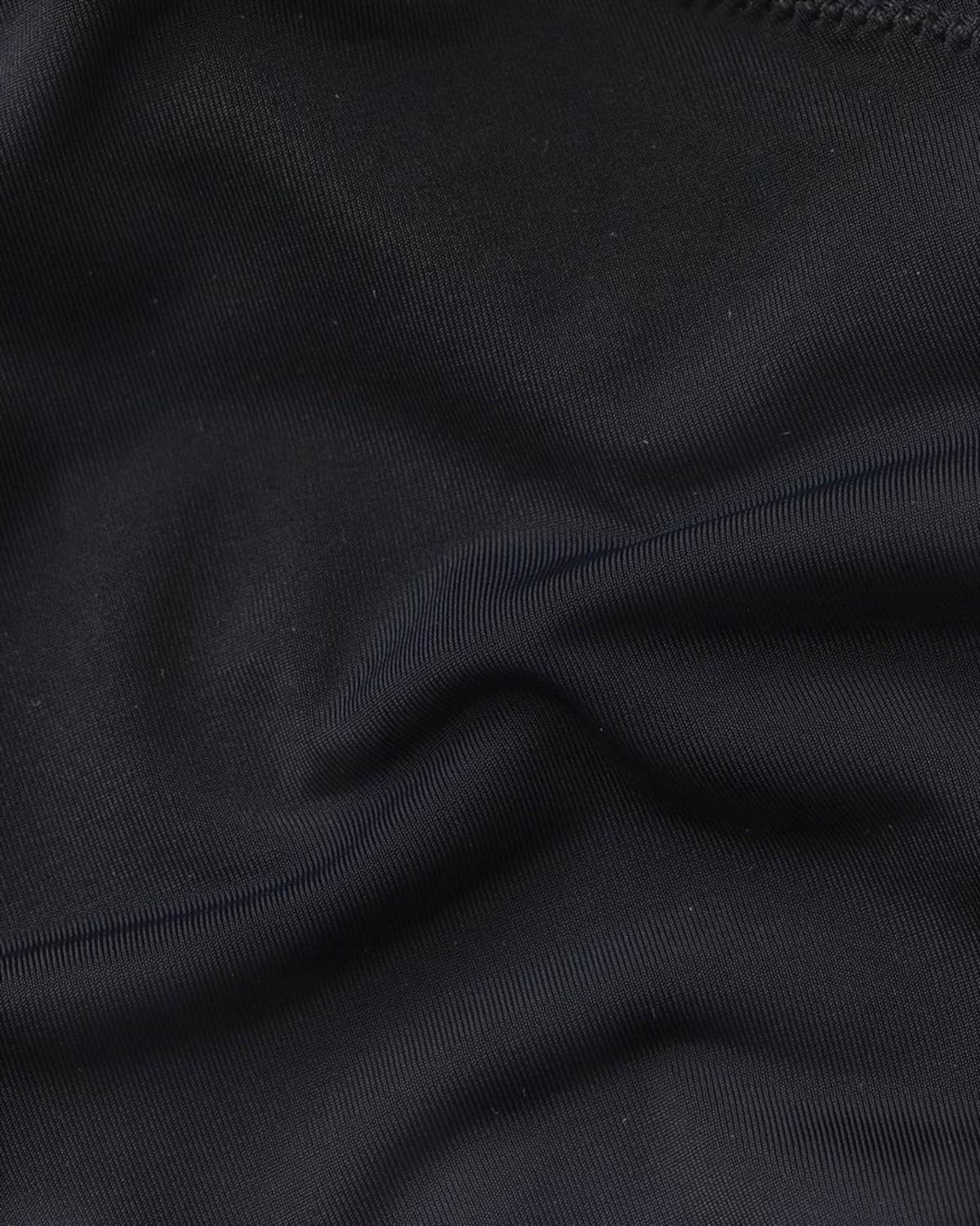 Close-up of smooth black stretch fabric