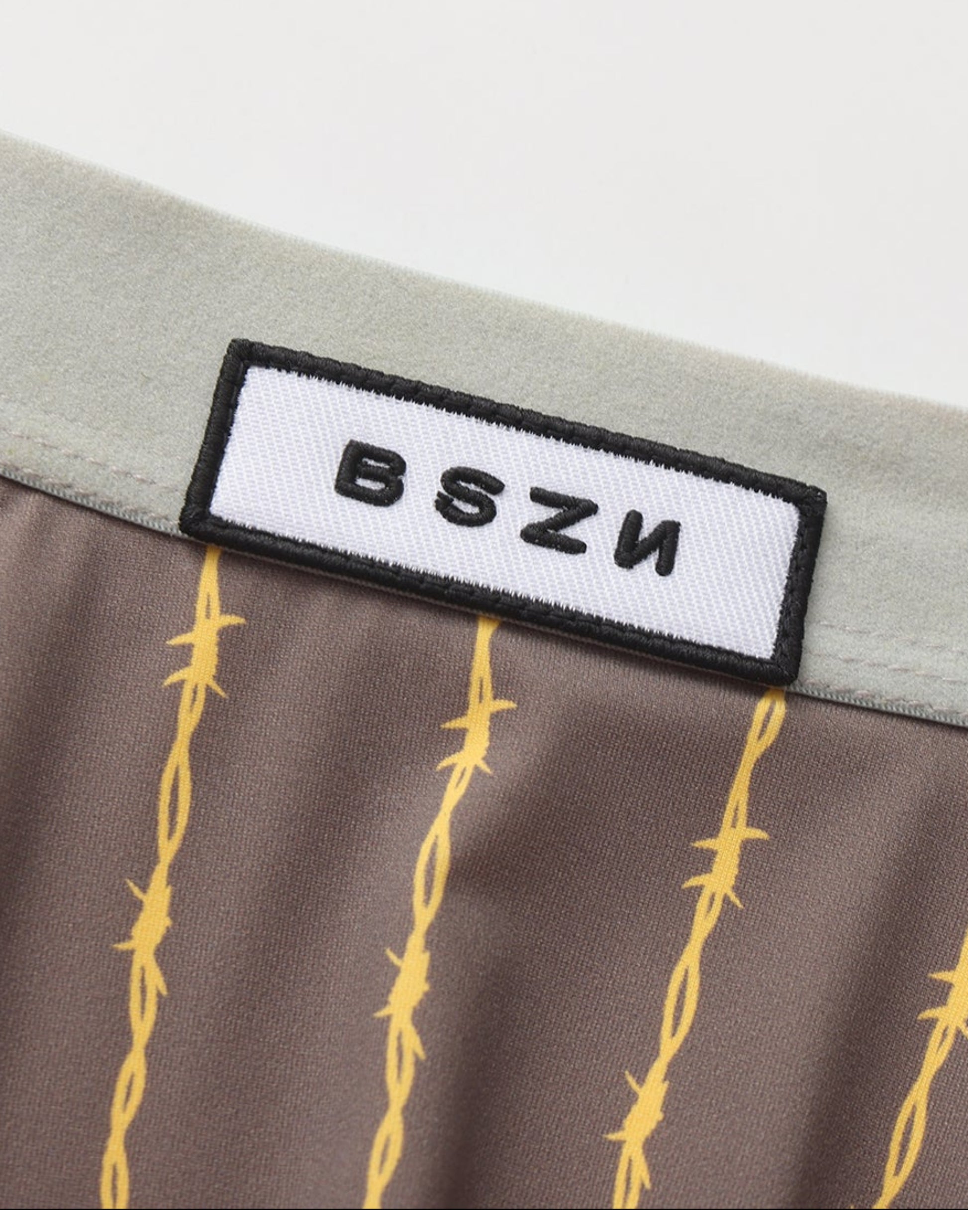 BSZN Thorn-Stripe Slash-Cut Brief, gray logo waistband detail