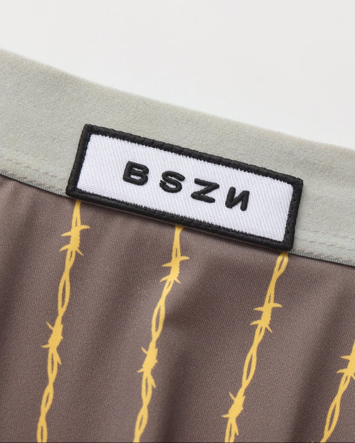 BSZN Thorn-Stripe Slash-Cut Brief, gray logo waistband detail