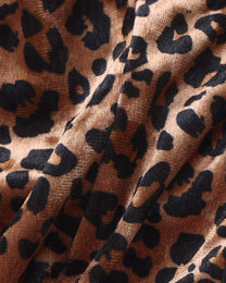Close-up of the brown leopard stretch fabric on the BSZN cage thong