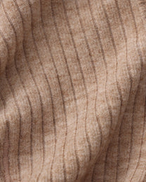 Close-up of the brown ribbed stretch fabric and seam texture