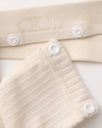 Close-up of the white snap connection and BSZN logo waistband