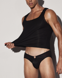 BSZN Black lace-trim tank on model, fabric extended at the hem.