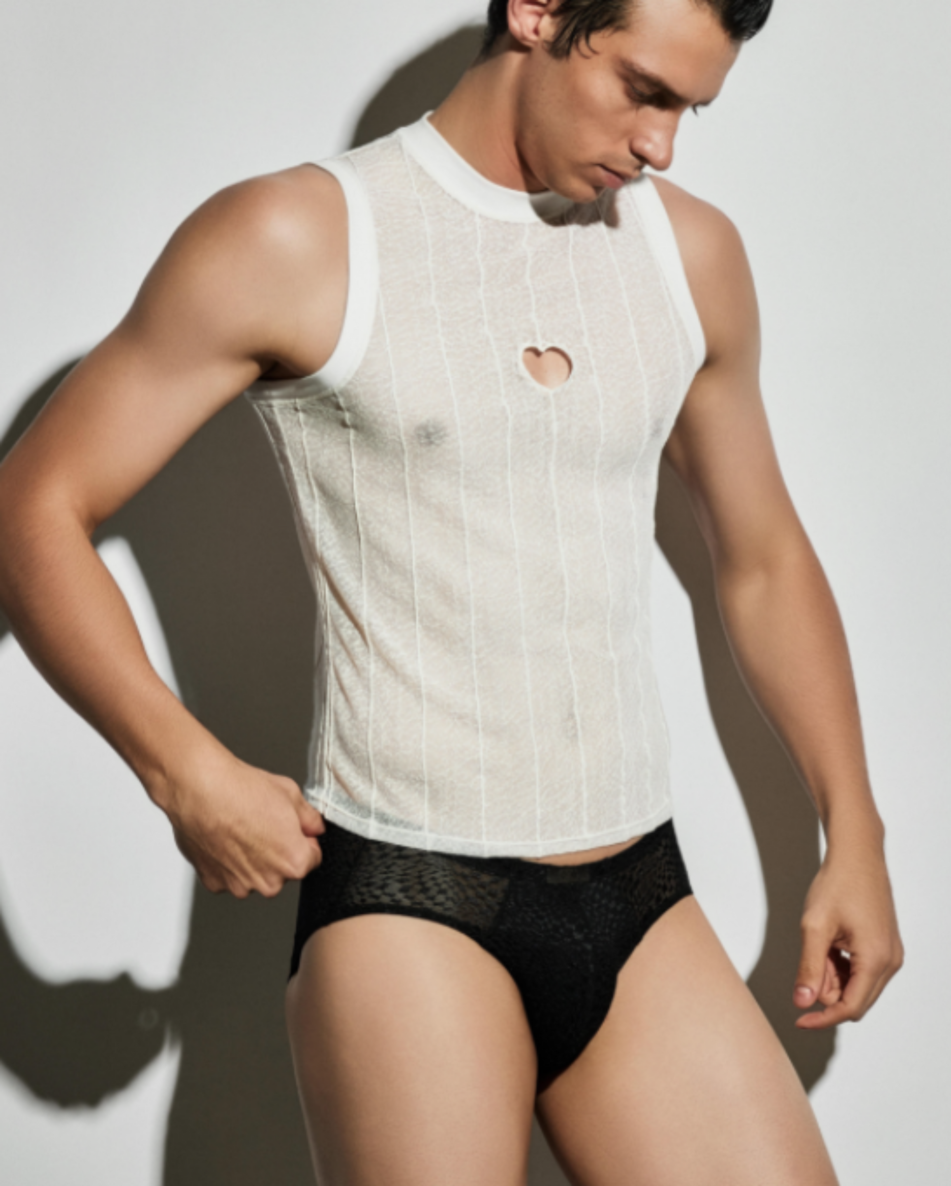 BSZN Distressed Trace Heart-Cutout Tank Top, in white on model, three-quarter front view
