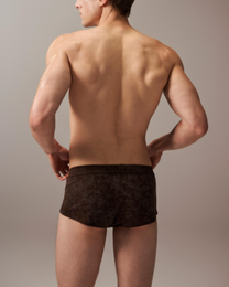 Model wearing the mottled brown BSZN slash-cut trunk, full-coverage rear view