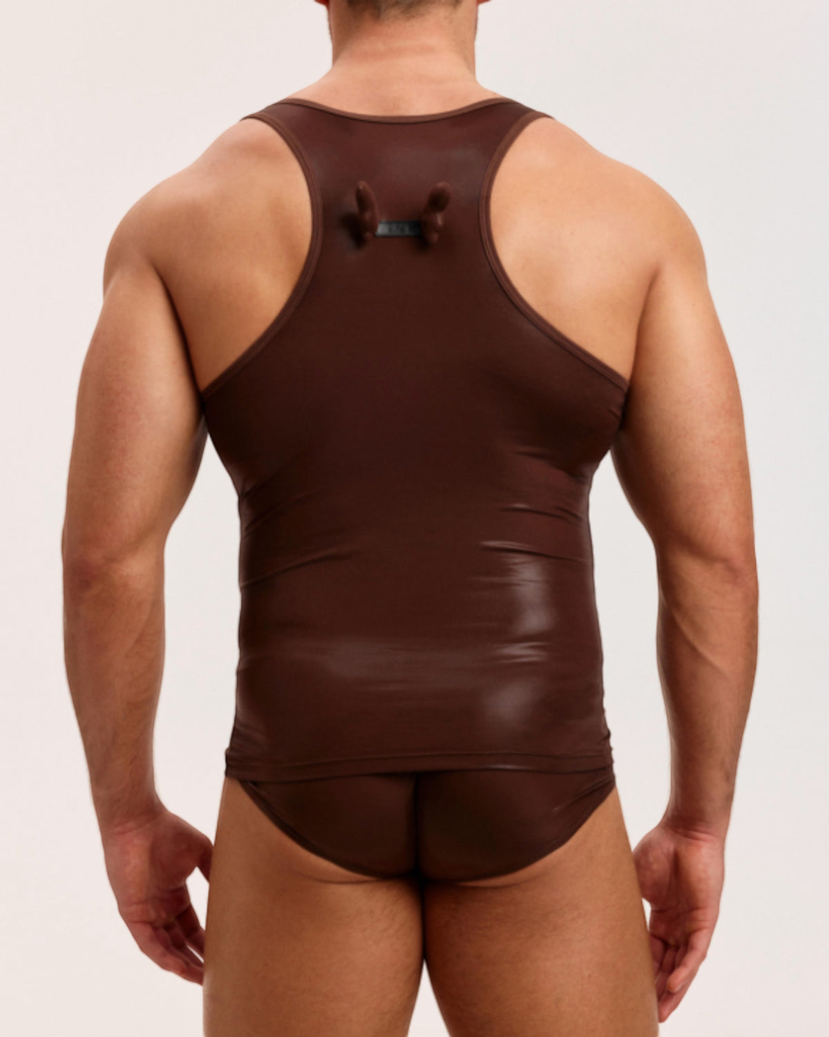 Model wearing the brown BSZN Liquid Skin Racerback Tank Top, back view