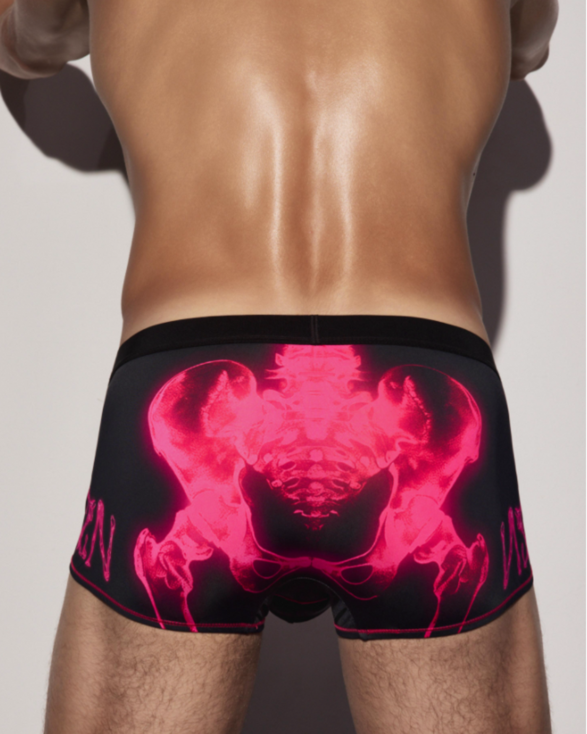 BSZN Pink skeleton graphic across the back, on model.