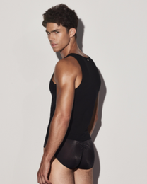 BSZN Black tank top on model, rear three-quarter view.